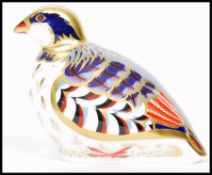 A Royal Crown Derby Red Legged Partridge paperweight, with red stamp to underside, dated 2015 and
