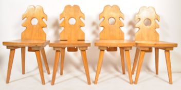 A set of 4 retro mid century Polish folk - country dining chairs of pine constuction being raised on