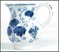 An early 19th century blue and white pearlware pearl ware hand painted sparrow beak miniature jug.