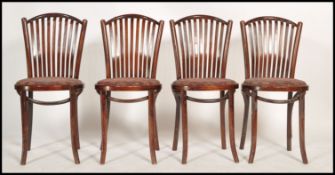 A set of 4 contemporary - retro style bentwood cafe chairs raised on turned legs with panel seats