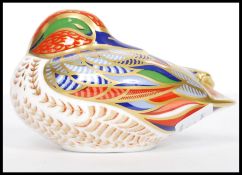 A Royal Crown Derby pattern teal paperweight, designed by Sue Rowe and fitted with a silver stopper,