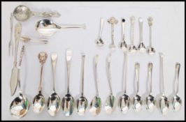 A good collection of silver hall marked spoons varying in sizes and uses from teaspoons to mustard