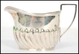An Victorian silver hallmarked creamer by Harrison Brothers & Howson (Henry Harrison), Sheffield