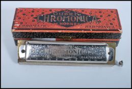 A vintage 20th century cased M Hohner Super Chromo