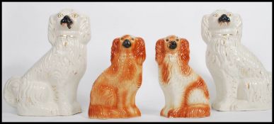 A pair of large 20th century Staffordshire dogs, possibly Beswick being white glazed together with
