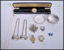 A group of silver and costume jewellery to include a hallmarked silver Nymph bangle bracelet with