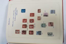 A vintage stamp album containing various stamps dating from the 19th century. Great Britain and