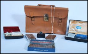 A collection of vintage 20th century razors to include three metal cased Rolls razors, Ronson
