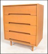 A 1970's retro light oak straight four drawer chest of drawers designed by John and Sylvia Reid