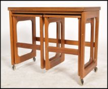 A vintage 20th century retro G Plan style teak wood coffee table nest having a larger rectangular