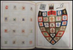 A Victorian album of Arms, Crests & Monograms having a fabulous collection of applied clipped