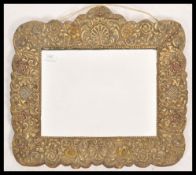 A 19th century Victorian brass framed wall mirror. The central bevelled glass panel having a
