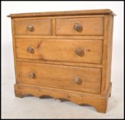 A 19th century Victorian country cottage scrubbed pine two short over two long chest of drawers,