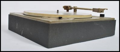 A vintage 20th century Lenco Goldring record player deck set on original stand, lacking hood
