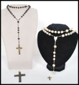 A group of vintage religious ecclesiastical jewellery to include a carved mother of pearl rosary