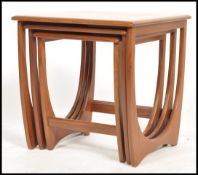 A 1970's G-Plan ' Astro ' teak wood nest of tables. The tables of graduating form with each being
