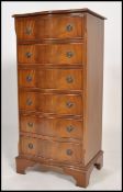 A good quality upright serpentine fronted mahogany chest of drawers being raised on bracket feet