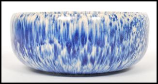A vintage 20th century blue crystal line half fire glaze bowl in the manner of Ruskin pottery.