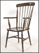 A Victorian beech and elm wood windsor chair / arm