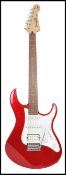 A vintage 20th century Yamaha electric six sting guitar. The shaped red body having a white