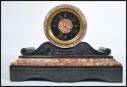 A 19th century French rouge marble barrel clock by Jean-Baptiste Delettrez. The 8 day movement