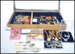 A collection of vintage and contemporary costume jewellery to include brooches, necklaces, bangles