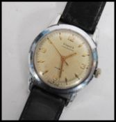 A vintage mid 20th century Phenix Chronostop 17 jewel Swiss made wrist watch having a silvered