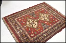 A 20th century wool rug of Persian / Islamic style