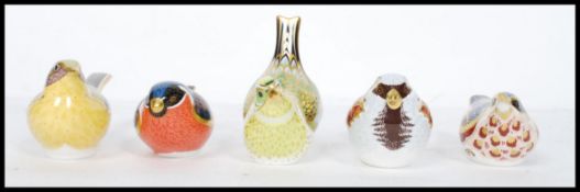 A collection of five Royal Crown Derby paperweights to include House Sparrow, Bullfinch ,