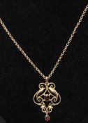 A 19th century Victorian 9ct gold garnet stone pendant set to a 9ct gold belcher link chain. The