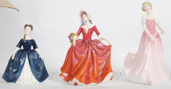 A group of vintage ceramic figures to include a Royal Doulton Debbie HN2385, Julie HN3878 and Autumn