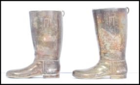 A pair of 20th century silver plated boot measures for spirits. one boot measures a single and the
