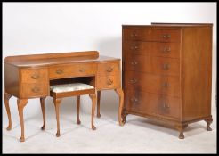 A mid 20th century walnut dressing table raised on  cabriole legs with triptych mirror atop,
