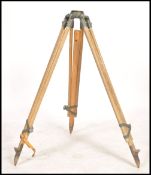 A vintage mid  20th century wooden surveyors Field Easel tripod retaining the original leather