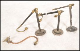 A set of 3 antique style 20th century wall mounted anglepoise lamps. Each with twin arms having
