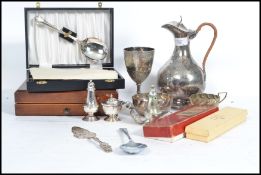 A collection of vintage 20th century silver plated wares to include a carafe by Walker and Hall,