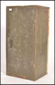 A retro 20th century industrial two tone painted metal storage cabinet locker. Of upright form