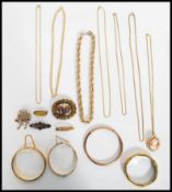 A good group of vintage jewellery to include a 9ct gold metal core bangle, yellow metal necklaces