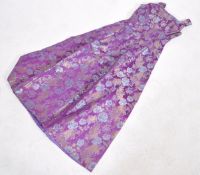 A vintage 20th century  ladies evening gown, purple ground with embroidered  floral pattern