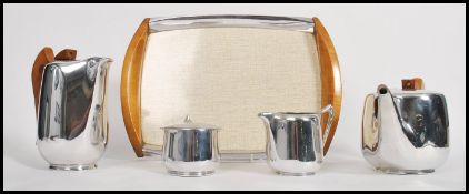 A mid 20th century retro Picquot ware stainless steel  and wooden tea service complete with original