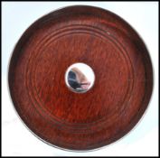 A large contemporary silver hallmarked W I Broadway & Co silver and  turned wood wine coaster.