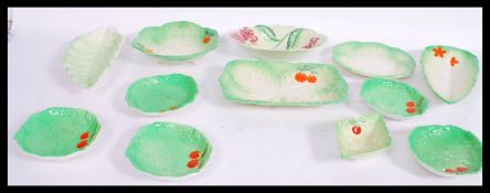 A collection of vintage mid 20th century leaf plates and dishes to include Carlton Ware, Beswick
