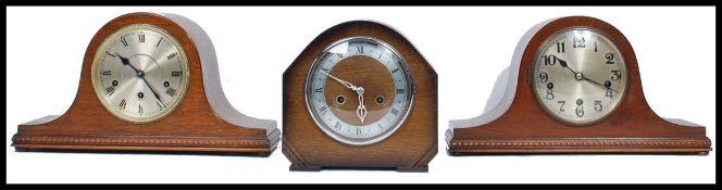 A group of vintage 20th century wooden cased mantle clocks to include two Napoleon hat clocks
