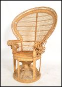 A good 20th century vintage late 1970's retro wicker peacock armchair -chair. Large open back