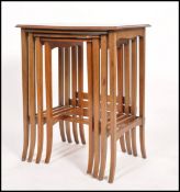 A 19th century Quartetto nest of four tables having quarter panel veneer tops. Raised on splayed