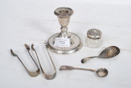 A hallmarked silver stub candle stick of larger form having a gadrooned circular base along with