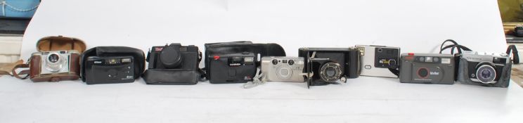 A collection of vintage 20th century cameras to include Paxette, Vivitar, Kodak folding camera Nikon