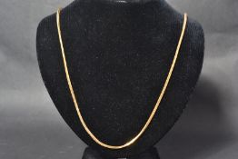 An 18ct gold 750 stamped herringbone link necklace chain having a bolt ring clasp. Measures 26