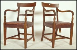 A pair of Regency mahogany bar back carver armchair each raised on reeded squared legs with