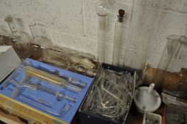 A large collection of vintage 20th century scientific lab glass to include various measures